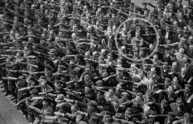 a lone man refusing to do the nazi salute 1936