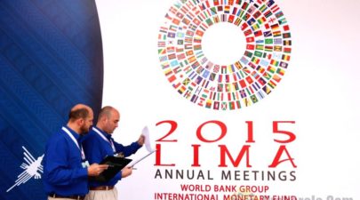 people walk past a poster of the world bank and 349226