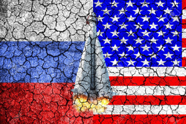 58139952 flag of russia and usa painted on the cracked wall concept of war cold war the arms race nuclear war