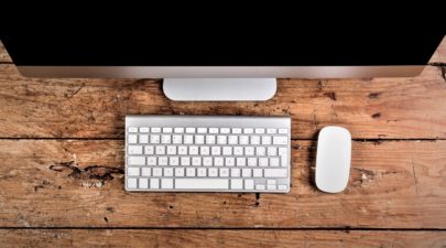 graphicstock computer keyboard and mouse layid on wooden office desk flat lay copy space HOeOSiHBM