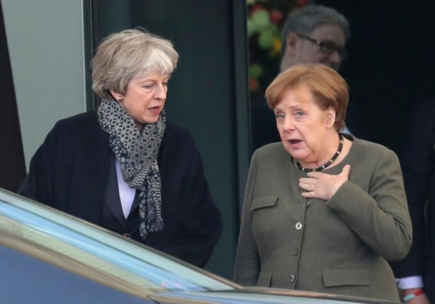 AP Theresa May Angela Merkel