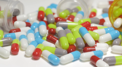 videoblocks 4k drugs medication pills capsules on a white table closeup rzc3s9n9x thumbnail full08