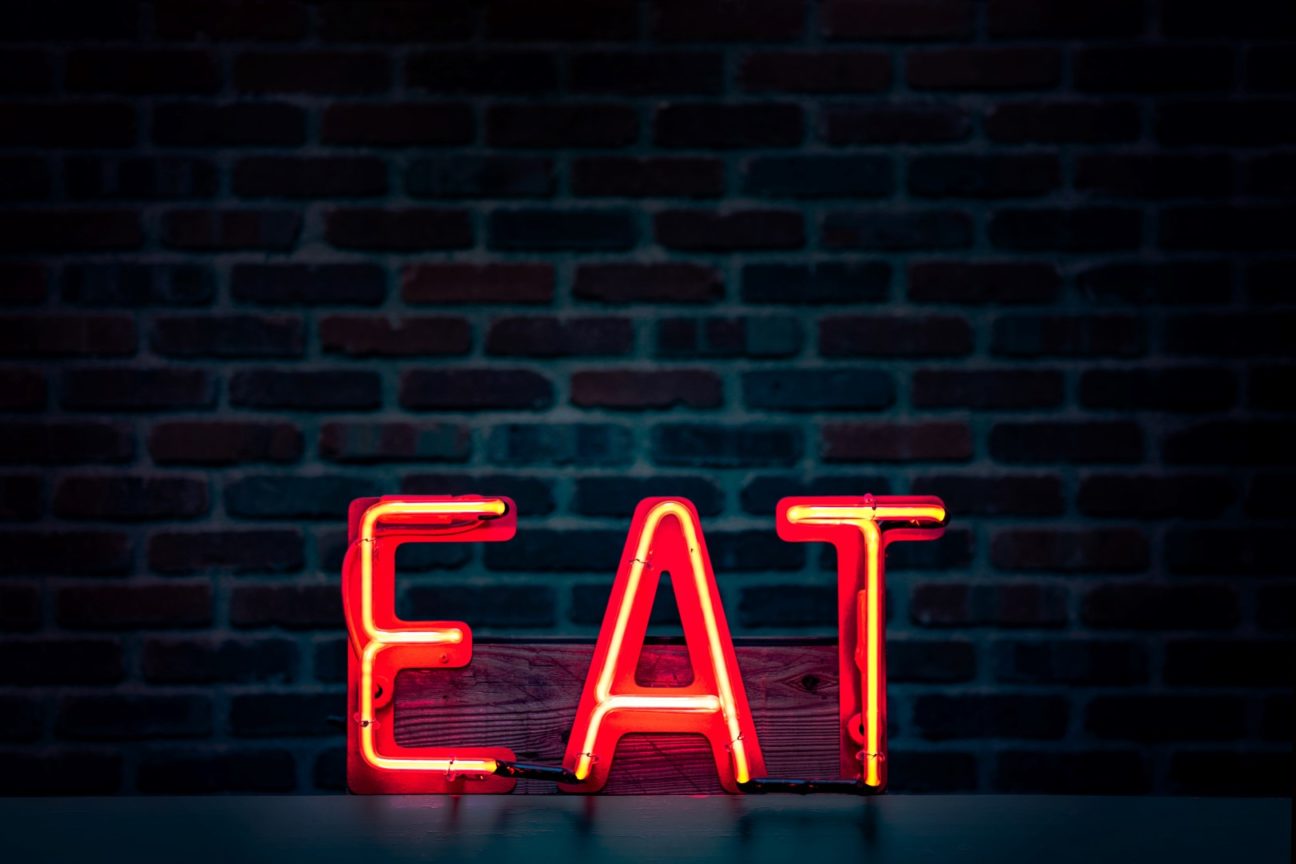 red eat neon sign turned on 1113520