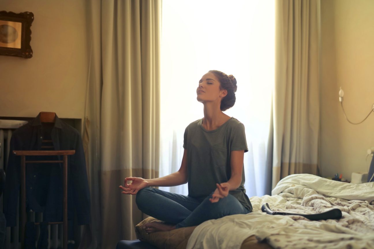 woman meditating in bedroom 3772612